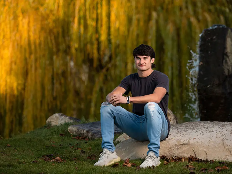 Musician senior portrait with instrument